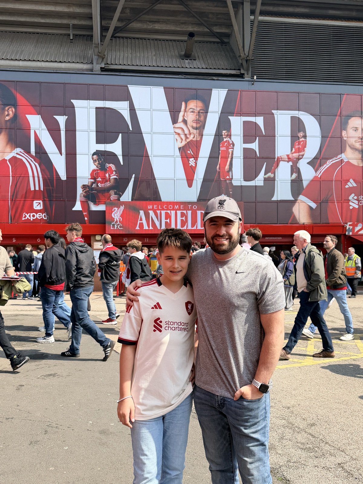 Made it — my son and me outside Anfield, an hour before kickoff.