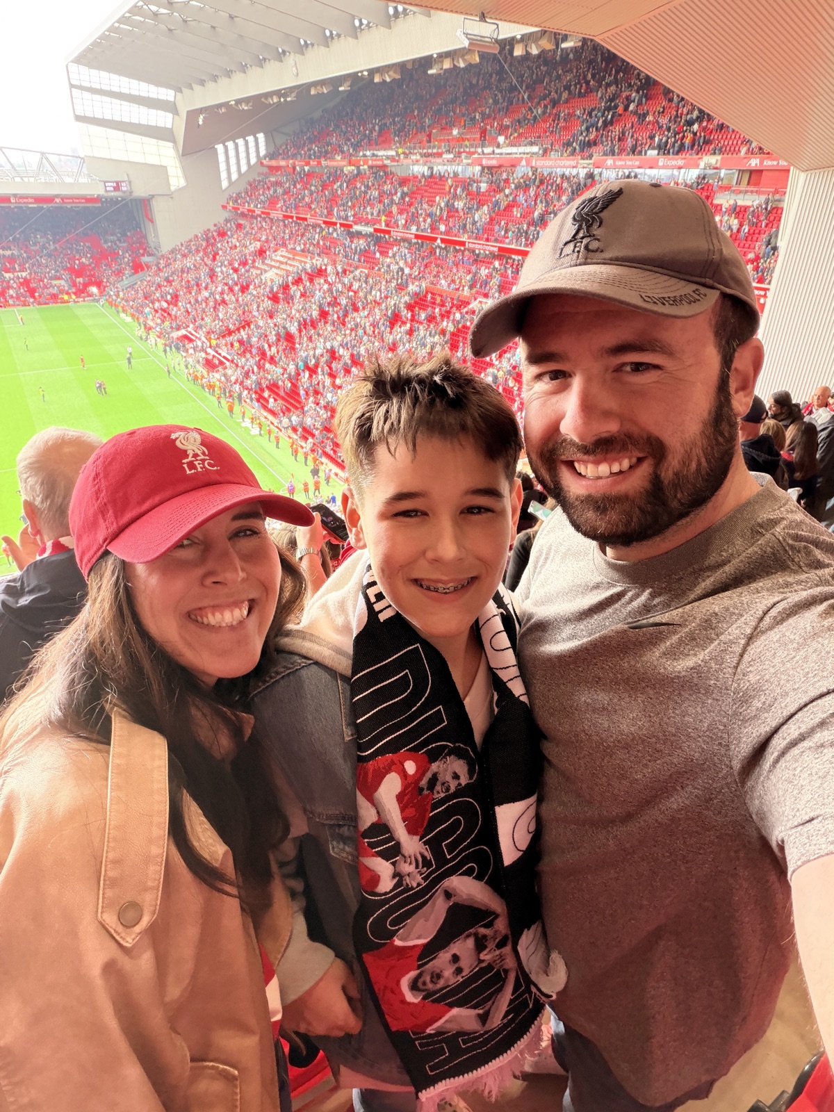 The three of us in the stands at Anfield — worth every minute of the morning.