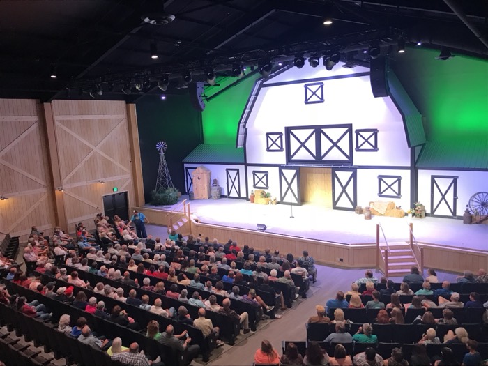 A Land Cruise crowd filling the theater — live shows are the heart of every trip.